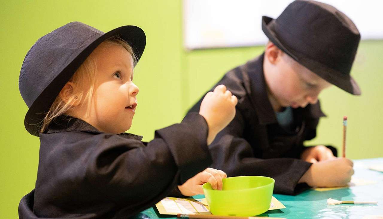 Two young people taking part in Spy School