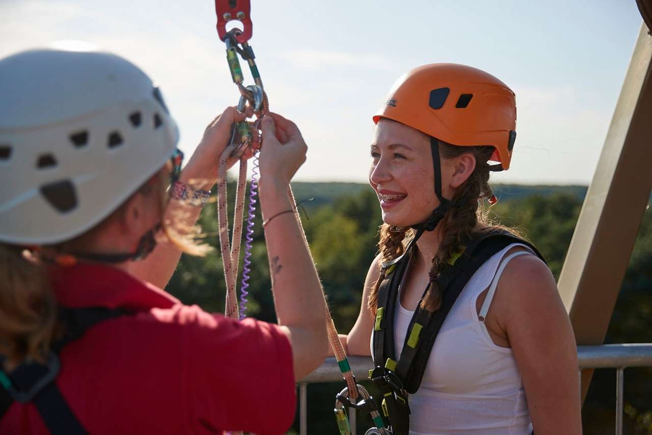 Someone tackling the Aerial Adventure course